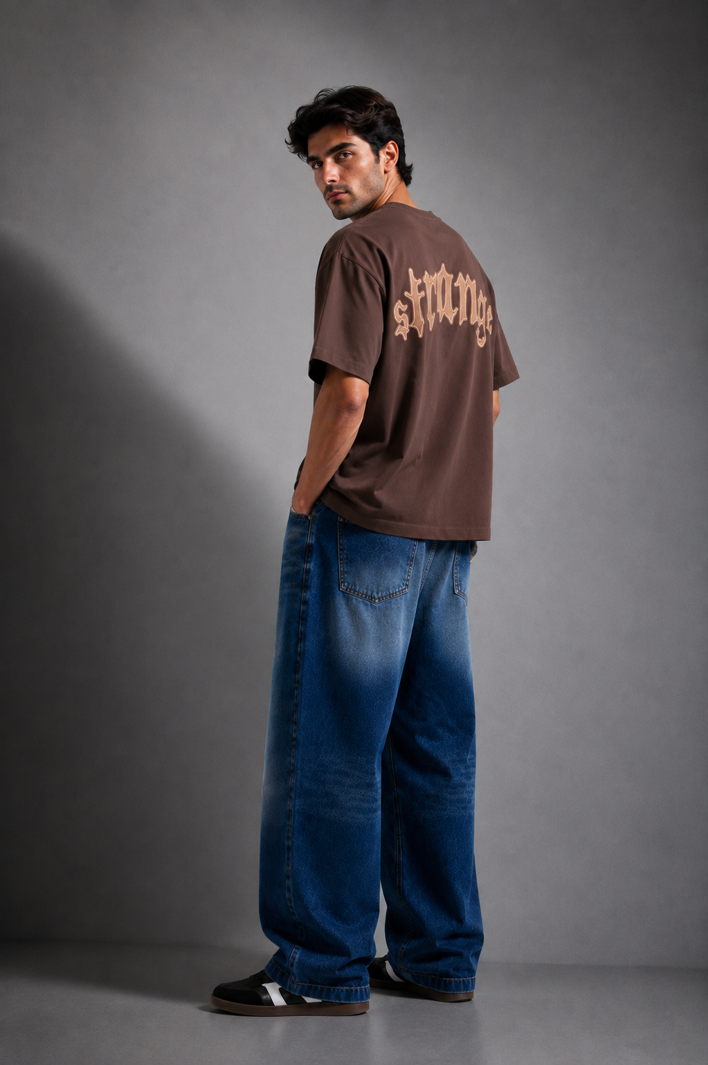 Brown oversized Strange t-shirt back graphic