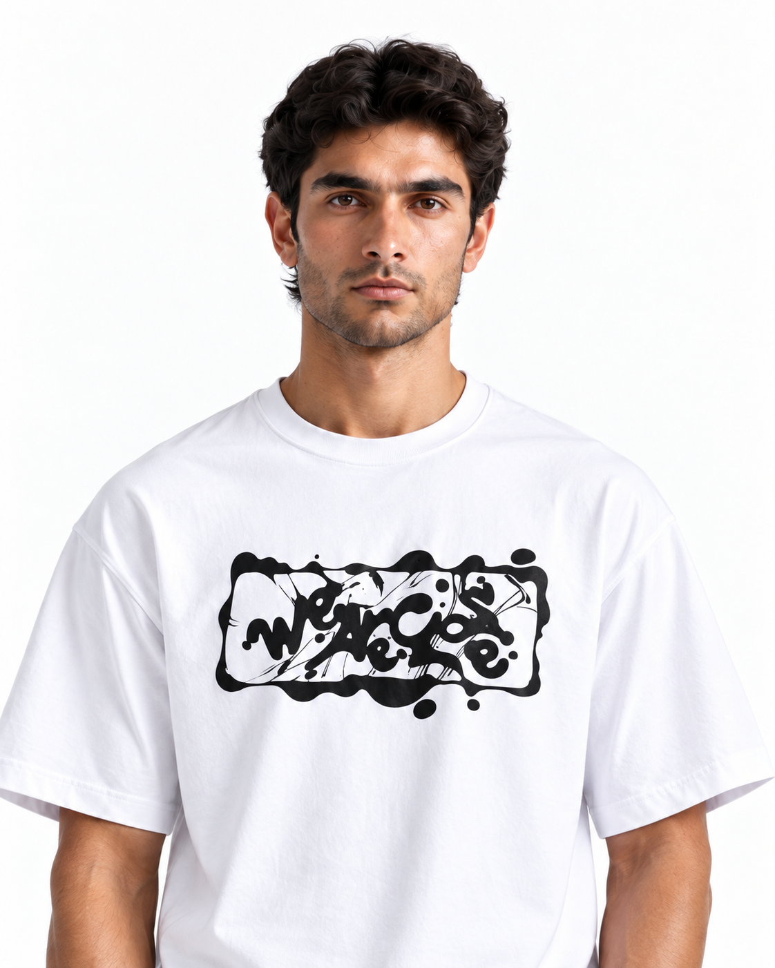 A man wearing a white crewneck t-shirt with a black graffiti-style graphic on the chest, photographed against a clean white background.