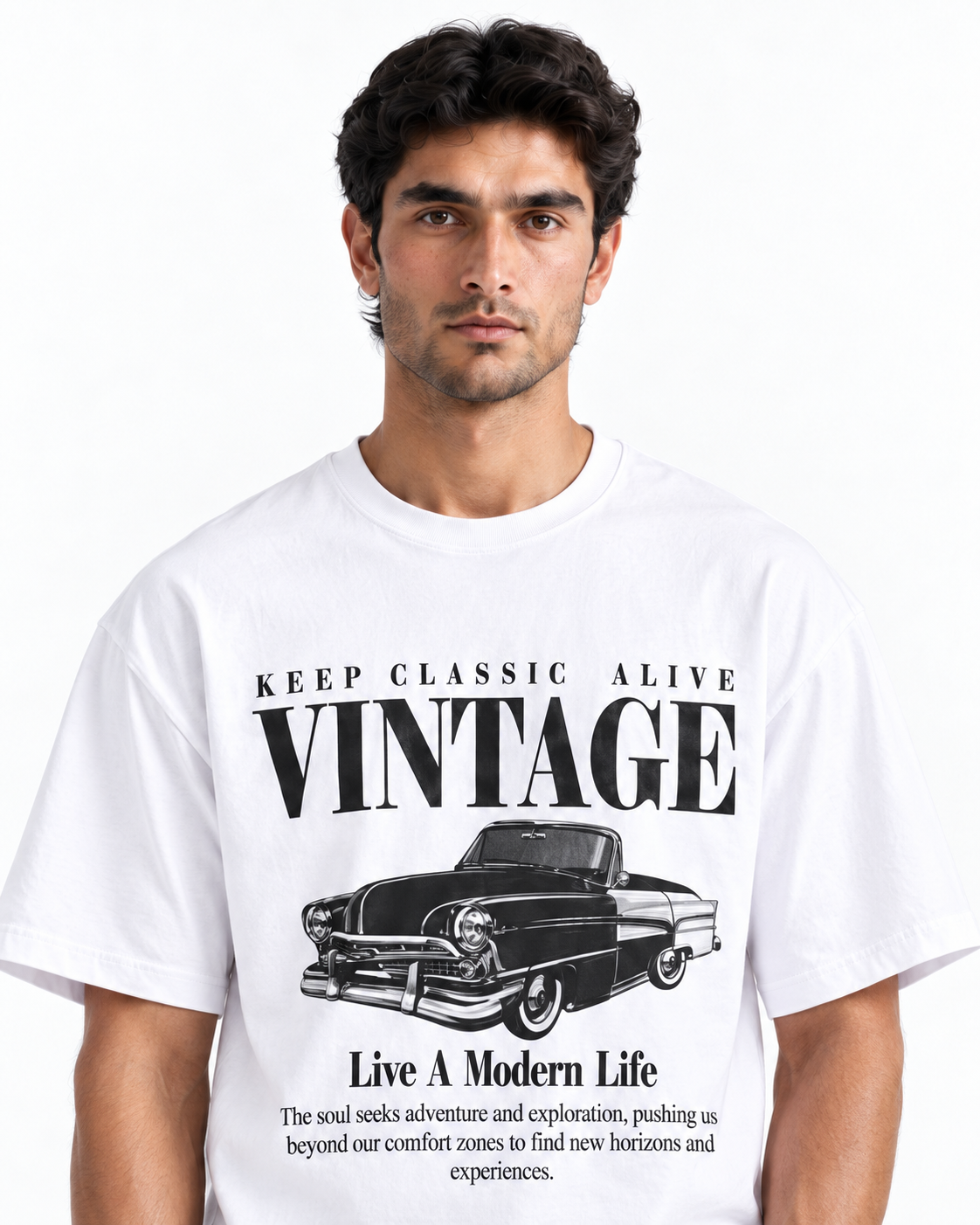 A man wearing a white short-sleeve graphic t-shirt with a black vintage car print and text reading 'KEEP CLASSIC ALIVE VINTAGE' and 'Live A Modern Life' on a plain white background.