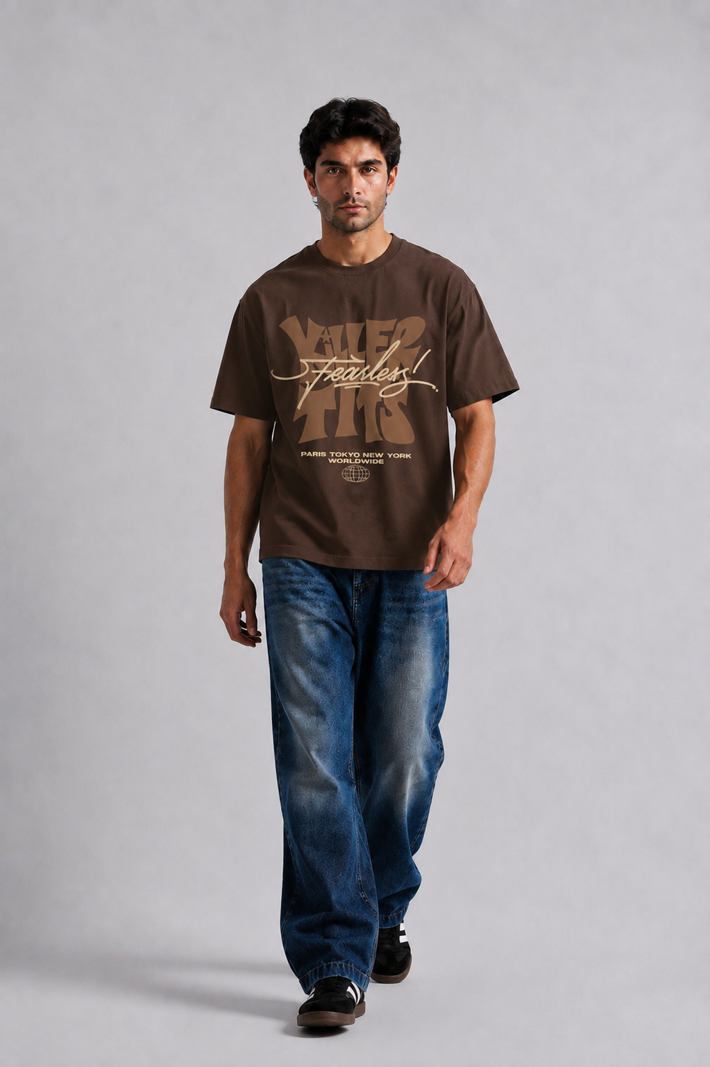 Fearless Worldwide oversized brown t-shirt styled with baggy jeans