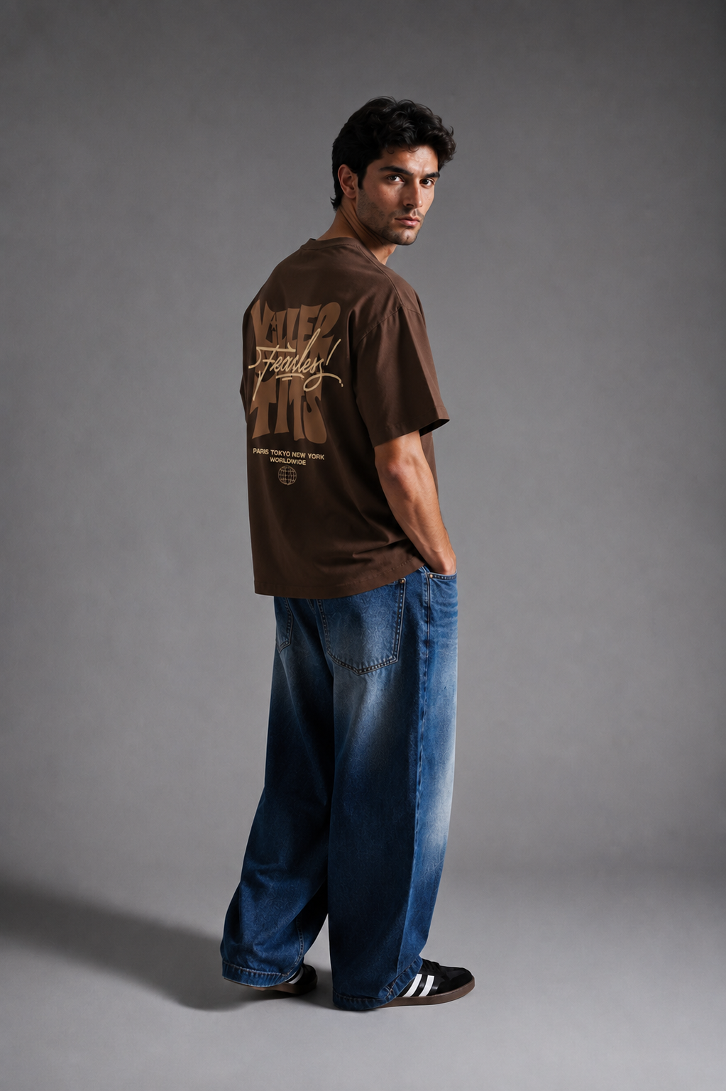 Model wearing brown Fearless oversized graphic t-shirt
